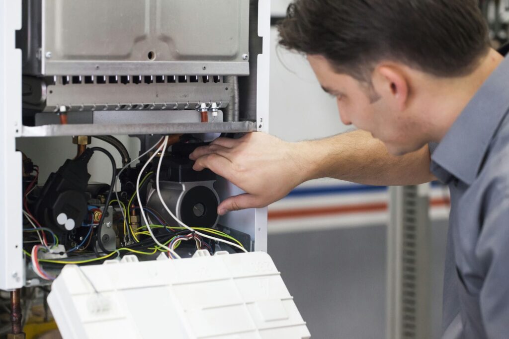 hvac contractor doing furnace maintenance