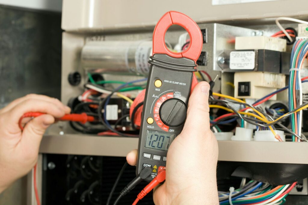 hvac contractor checkcing furnace voltage