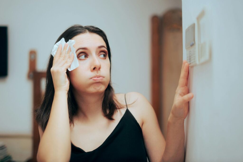 woman disgruntled from AC not working