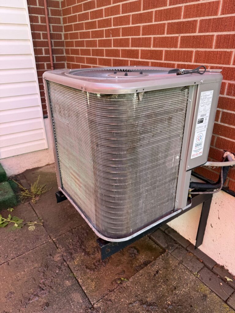 Same Lennox condenser coil fully cleaned and clear of debris after an AC maintenance visit at a Waterloo rental property